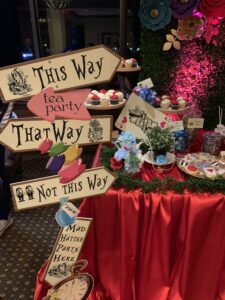 A table with signs and food on it