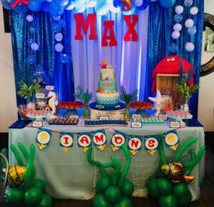 A table with balloons and decorations on it