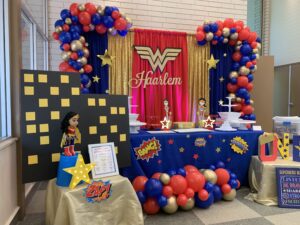 A table with balloons and decorations on it
