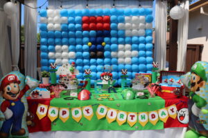 A table with balloons and decorations on it