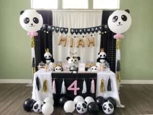 A table with balloons and decorations on it