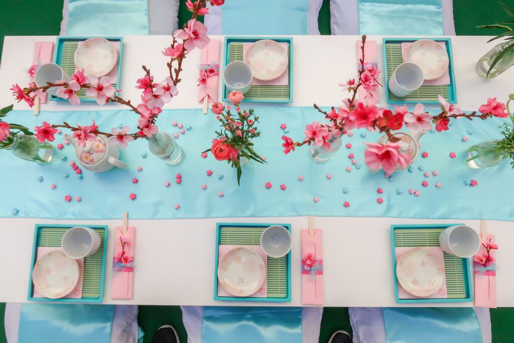 A table set with plates and cups on top of it.