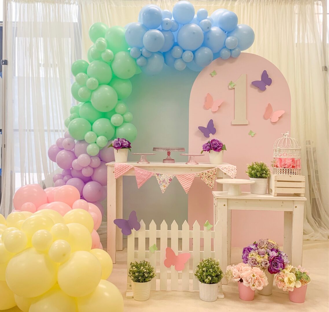 A room with balloons and flowers in it
