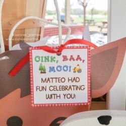 A close up of a sign with the words oink, baa, moo