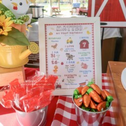 A table with a sign and some carrots