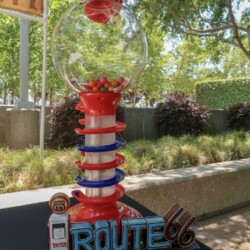 A red and blue sculpture of a road sign.