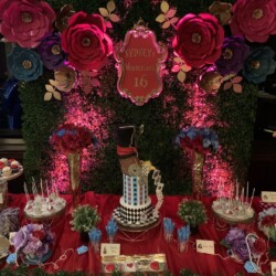 A table with flowers and candles on it