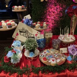 A table with many different types of cakes.