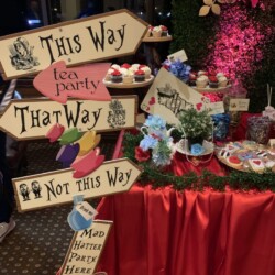 A table with signs and food on it