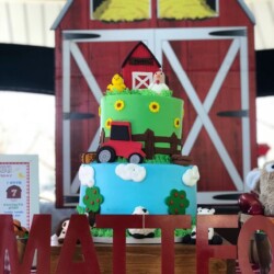 A cake with a farm theme on top of it.