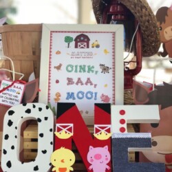 A stack of wooden letters with different animal designs.