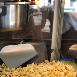 A close up of popcorn in front of an oven
