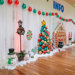 A room decorated with balloons and decorations.