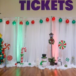 A room with balloons and lights on the wall