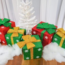 A group of christmas presents sitting on top of snow.