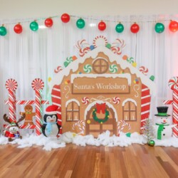 A christmas themed photo booth with decorations and lights.
