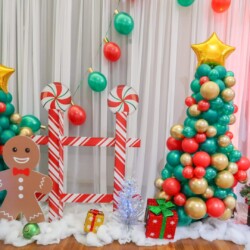 A christmas tree and decorations on display.
