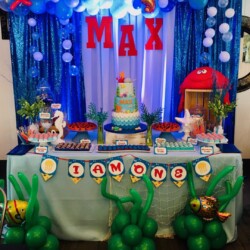 A table with balloons and decorations on it