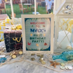 A sign that says welcome to m-fox 's first birthday party.