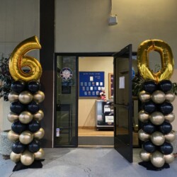 A doorway with balloons and numbers in the center.