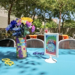 A table with flowers and glasses on it