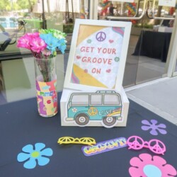 A table with flowers and decorations on it.