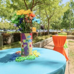 A table with a vase of flowers on it