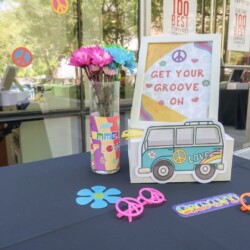 A table with flowers and decorations on it.