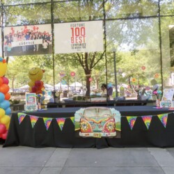 A table with balloons and decorations on it