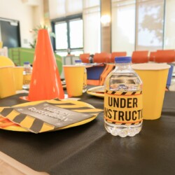 A table with construction themed plates and cups.