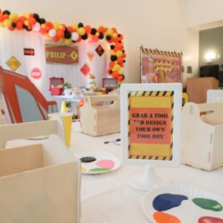 A table with boxes and decorations on it