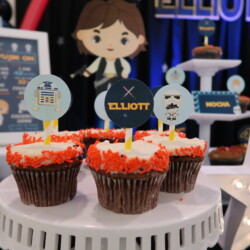 A table with some cupcakes on top of it