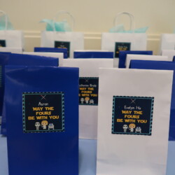 A table with bags of gift wrapping and labels.