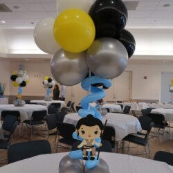 A table with balloons and decorations on it