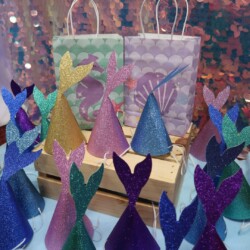 A table with many different colored paper trees