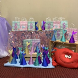 A table with bags and hats on it