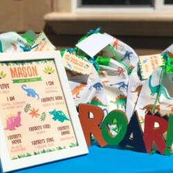 A table with some bags of paper and a sign