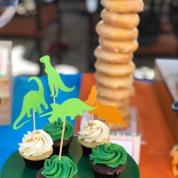 A table with cupcakes and donuts on it