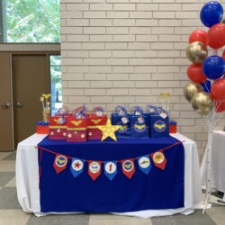 A table with balloons and decorations on it