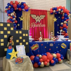 A table with balloons and decorations on it