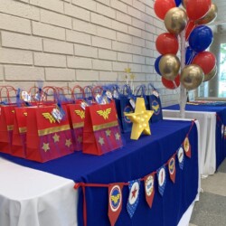 A table with bags and balloons on it