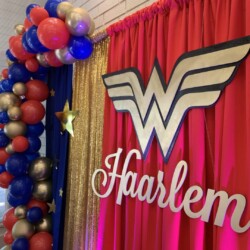 A red curtain with the word harlem on it.