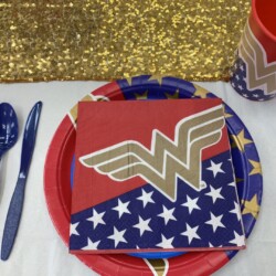A table set with plates, cups and napkins.