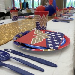 A table set with plates, cups and utensils.