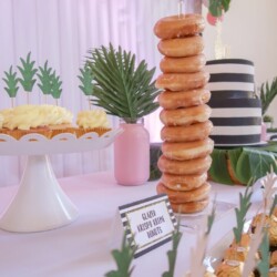 A table with donuts and cakes on it