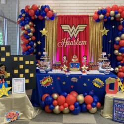 A table with balloons and decorations on it