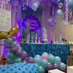 A room with balloons and decorations on the walls.