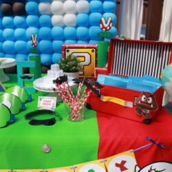 A table with balloons and decorations on it