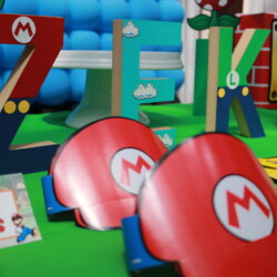 A table with mario gloves and other decorations.