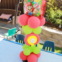 A table with balloons and a balloon tower